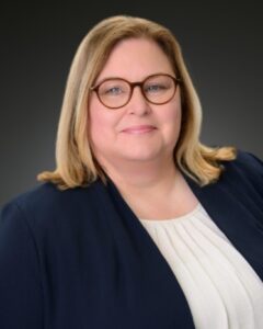 Headshot of blonde women with glasses