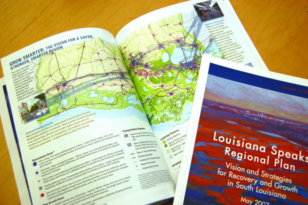Booklets on a table with the cover reading "Louisiana Speaks Regional Plan"